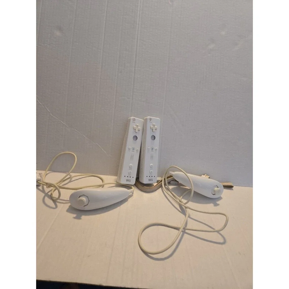 Pair Of Nintendo Wii Remotes With Nunchucks